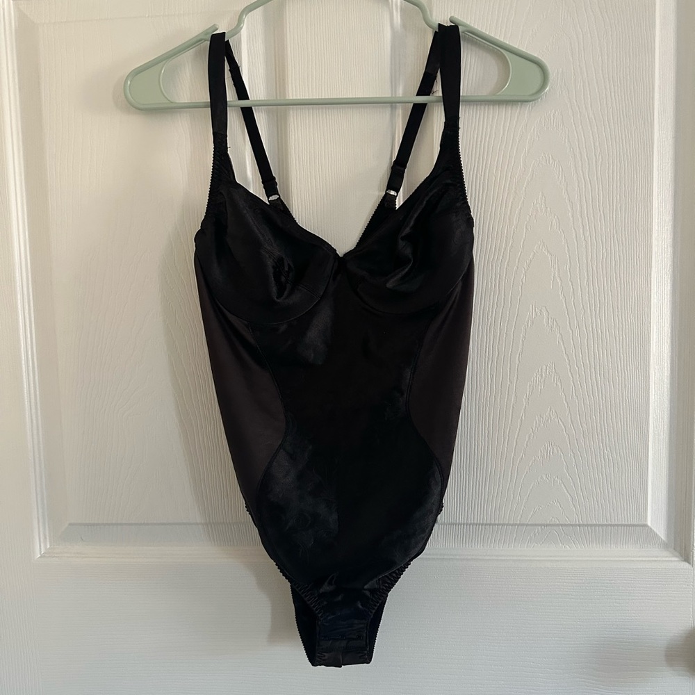 Black corset body suit.